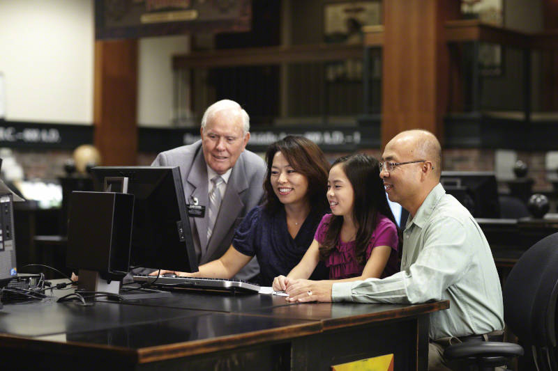 People working on Family History at the Family History Center.